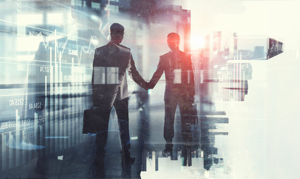 Two people shaking hands in a business deal