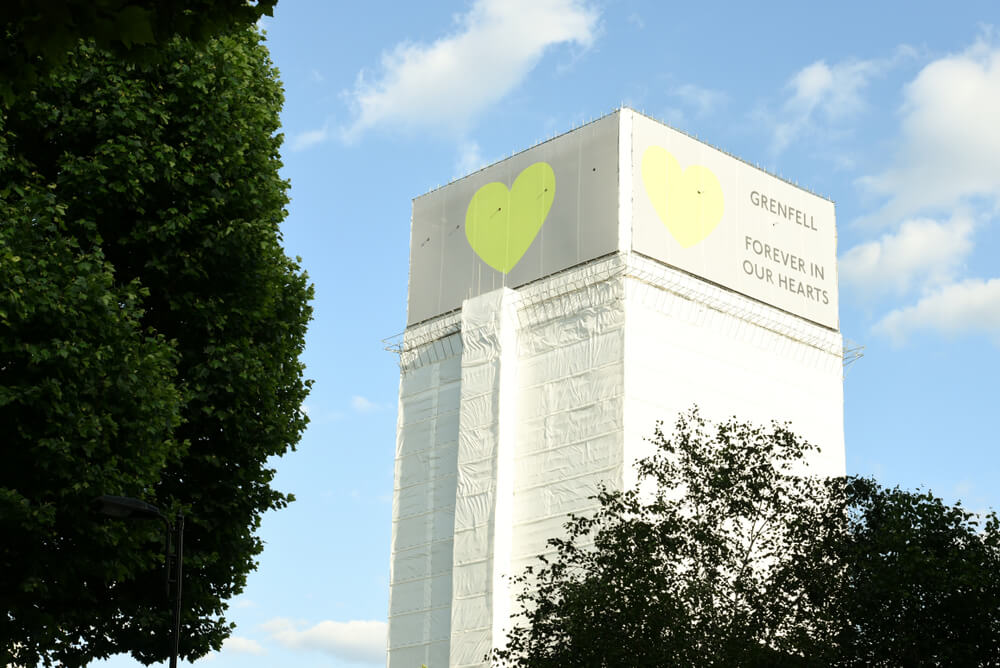 The Grenfell Tower surrounded by a hoarding