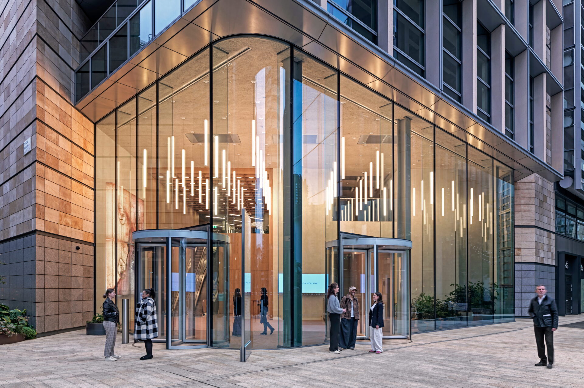 Exterior of a modern office building with a large glazed entrance area