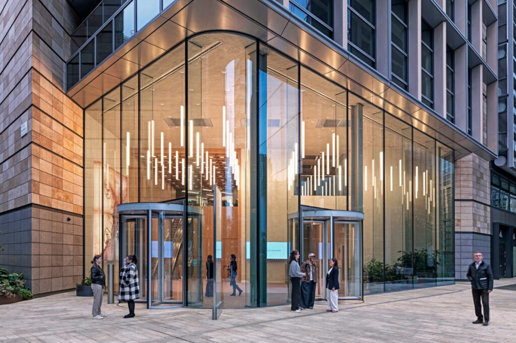 Exterior of a modern office building with a large glazed entrance area