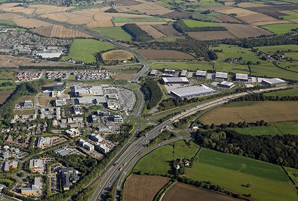A CGI aerial view of the proposed Integral logistics scheme in Leeds surrounded by Thorpe Park and lots of fields