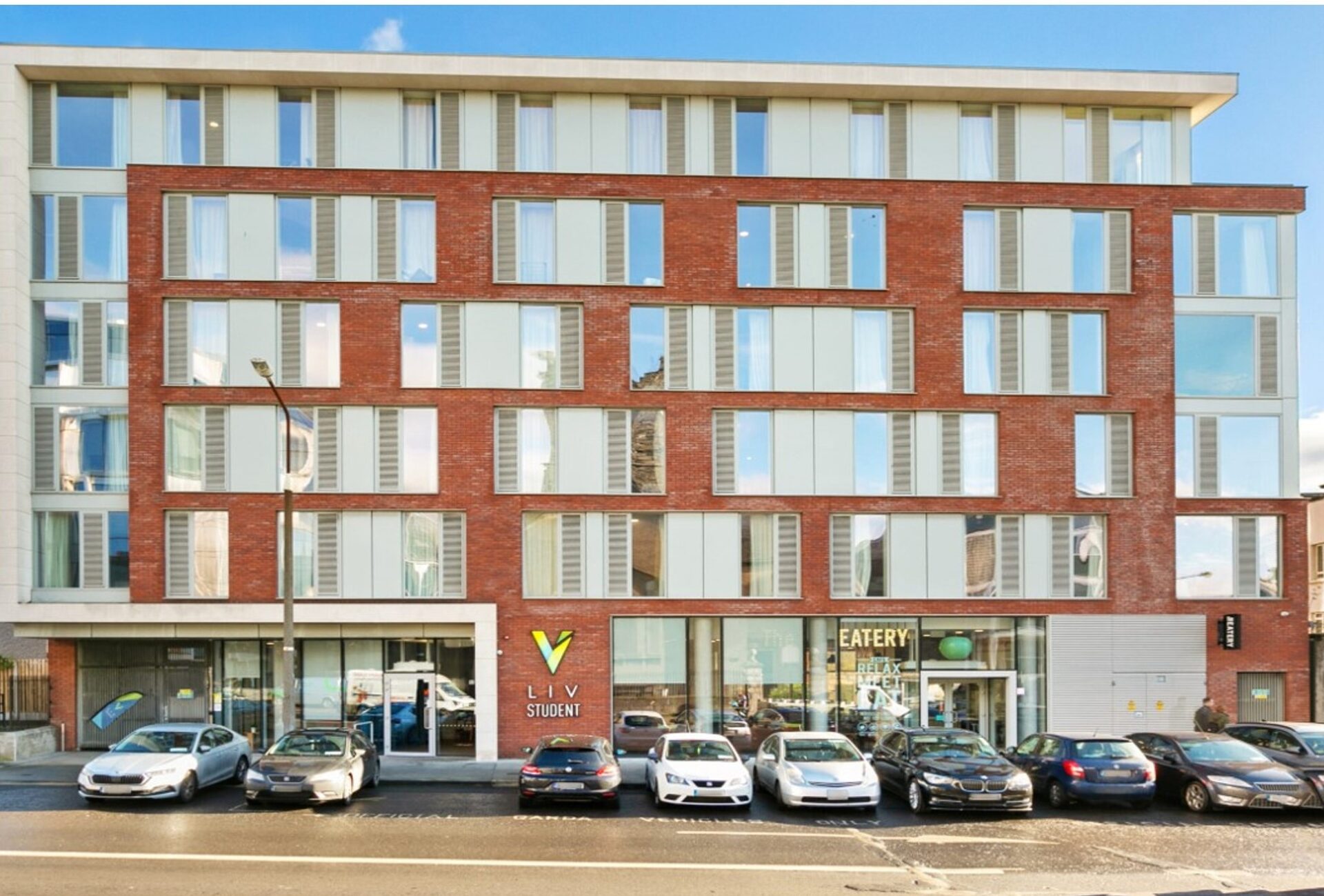 A low rise PBSA building on Church Street in Dublin with a white stone and brick facade