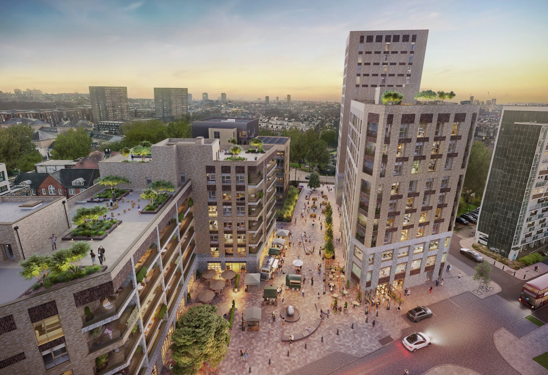CGI aerial view featuring a low rise residential building to the left and a larger tower to the right set on a pedestrianised site with lots of people walking around