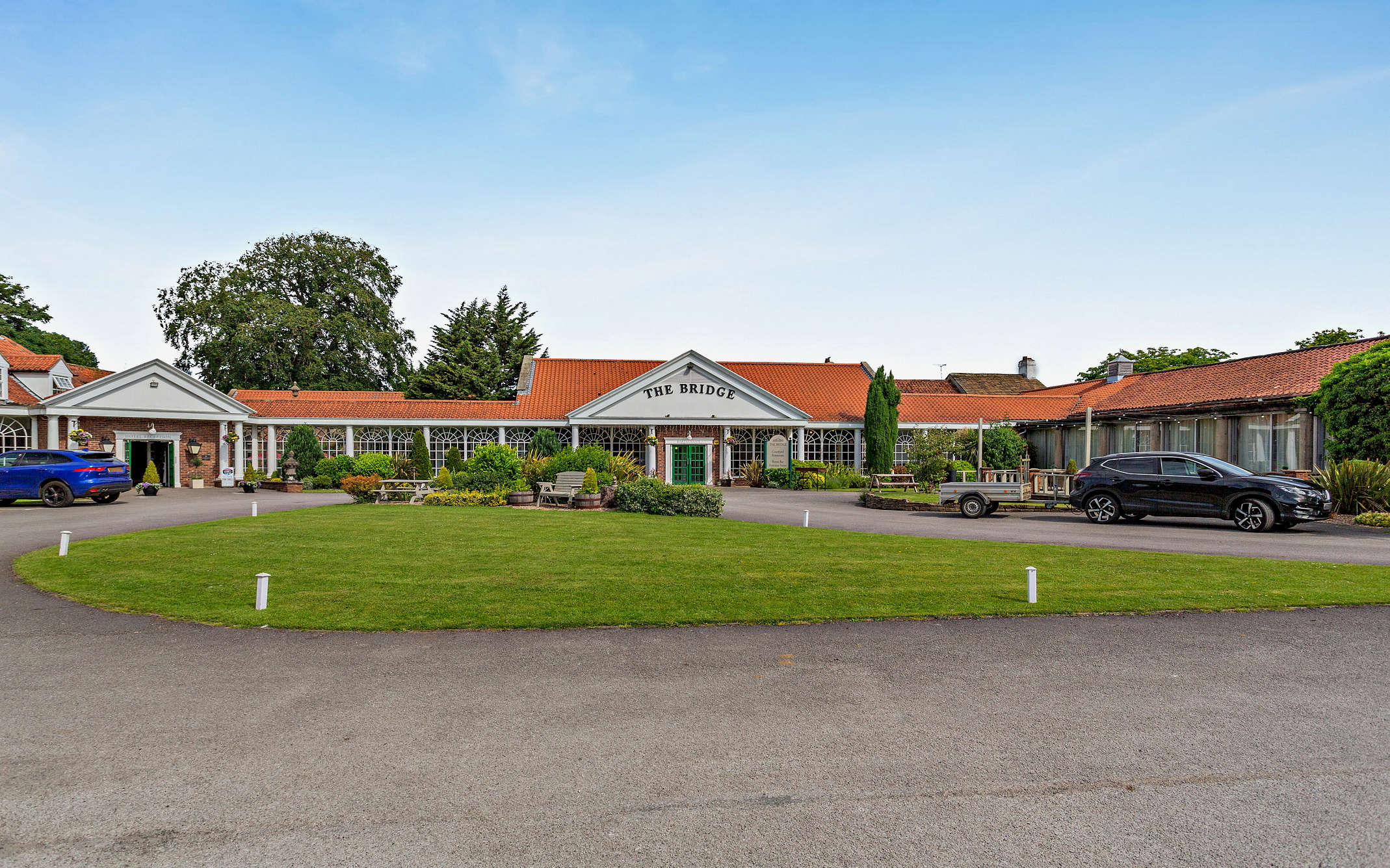 The Bridge Hotel in Wetherby with a large lawn area at the front of the property
