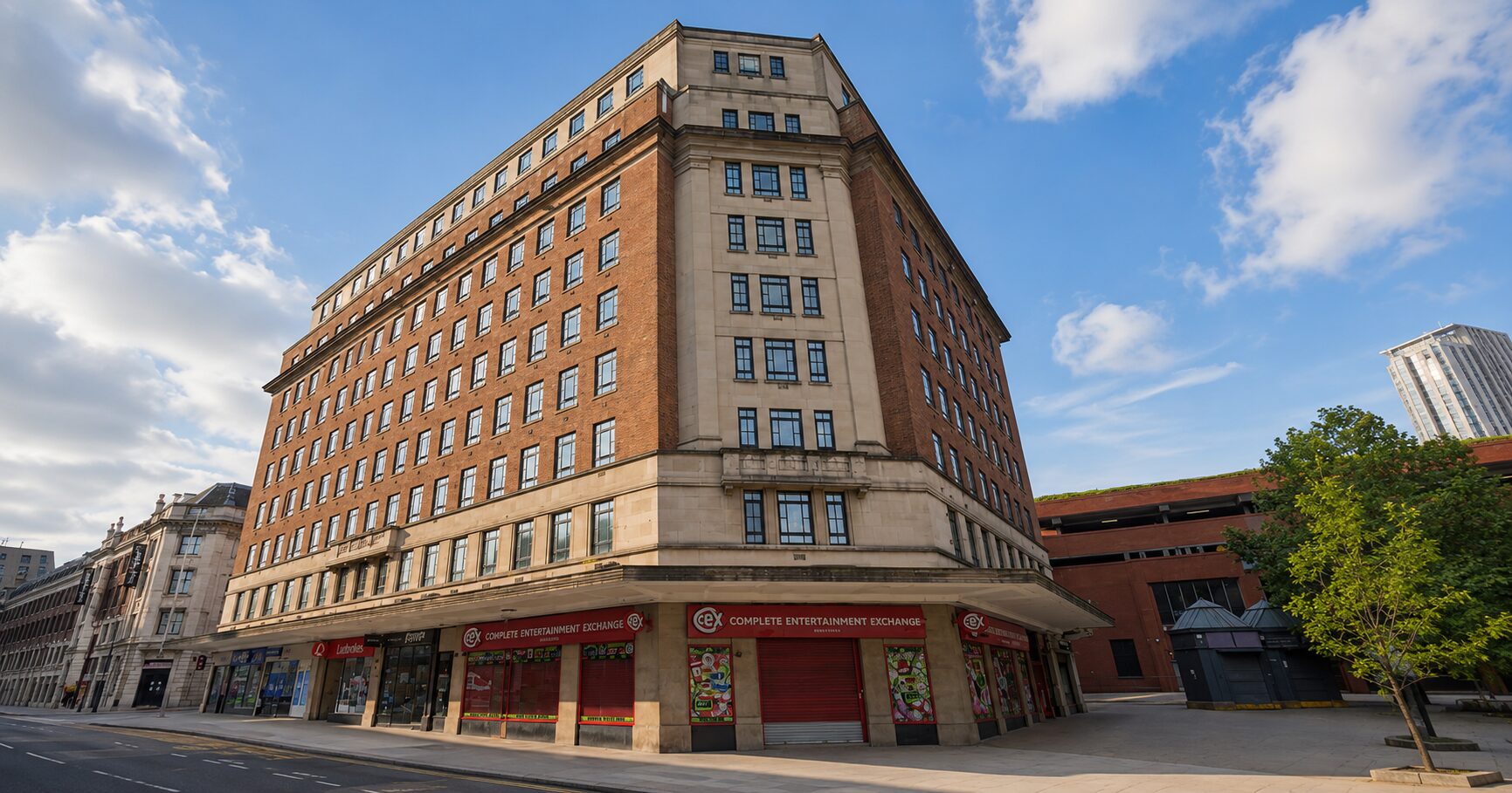 Exterior of a brick built corner office building with retail space on the ground floor