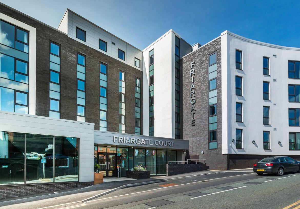 Exterior of a low rise student accommodation building on a main road
