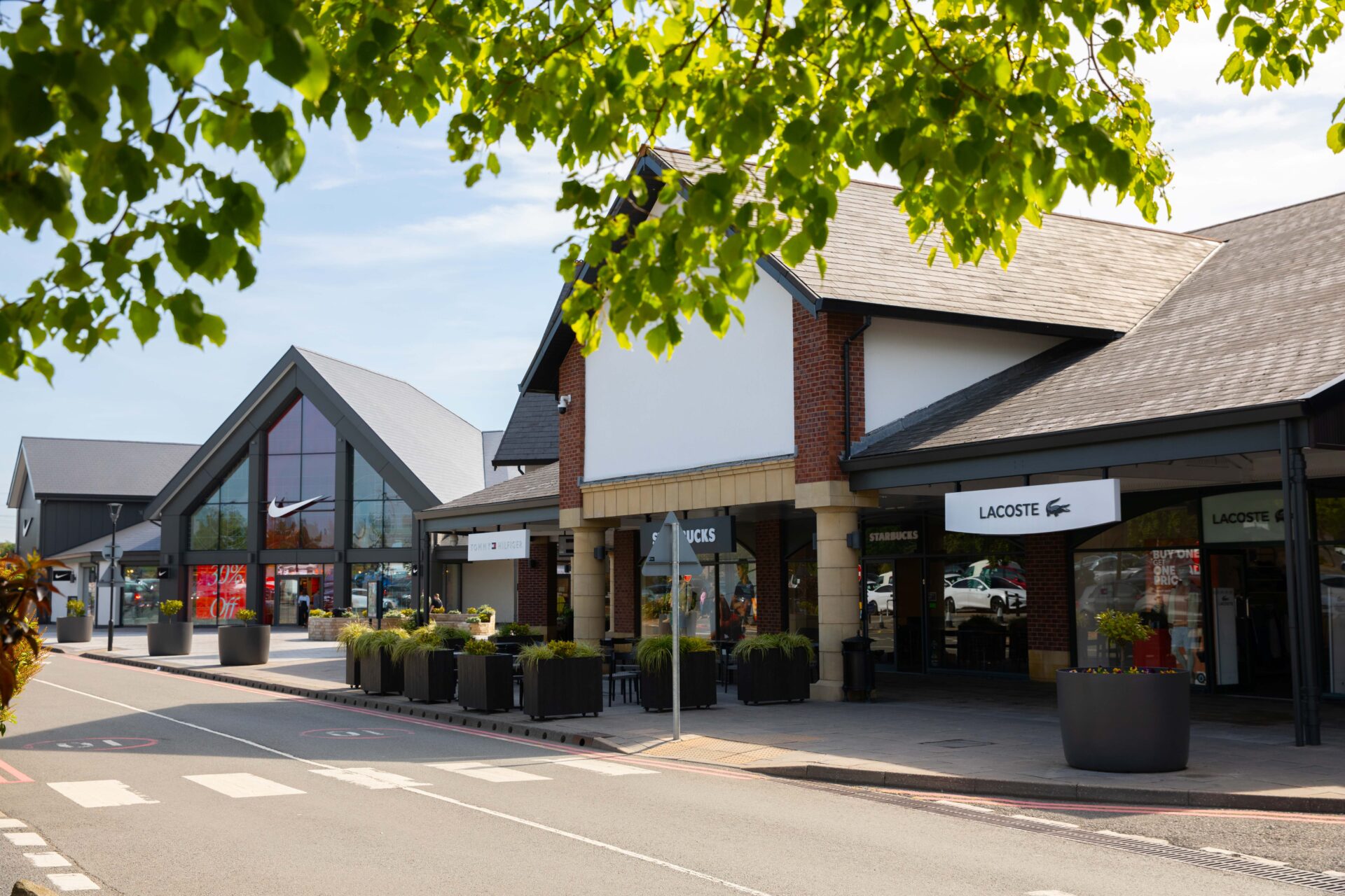 Exterior of a row of retail outlets at the East Midlands Designer Outlet