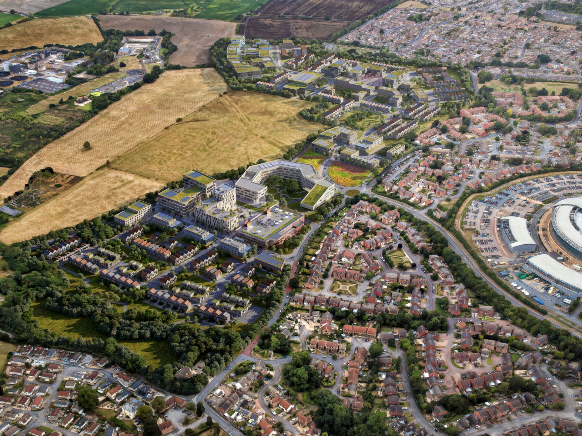 CGI aerial view showing new homes surrounding a commercial hub with green fields in the distance