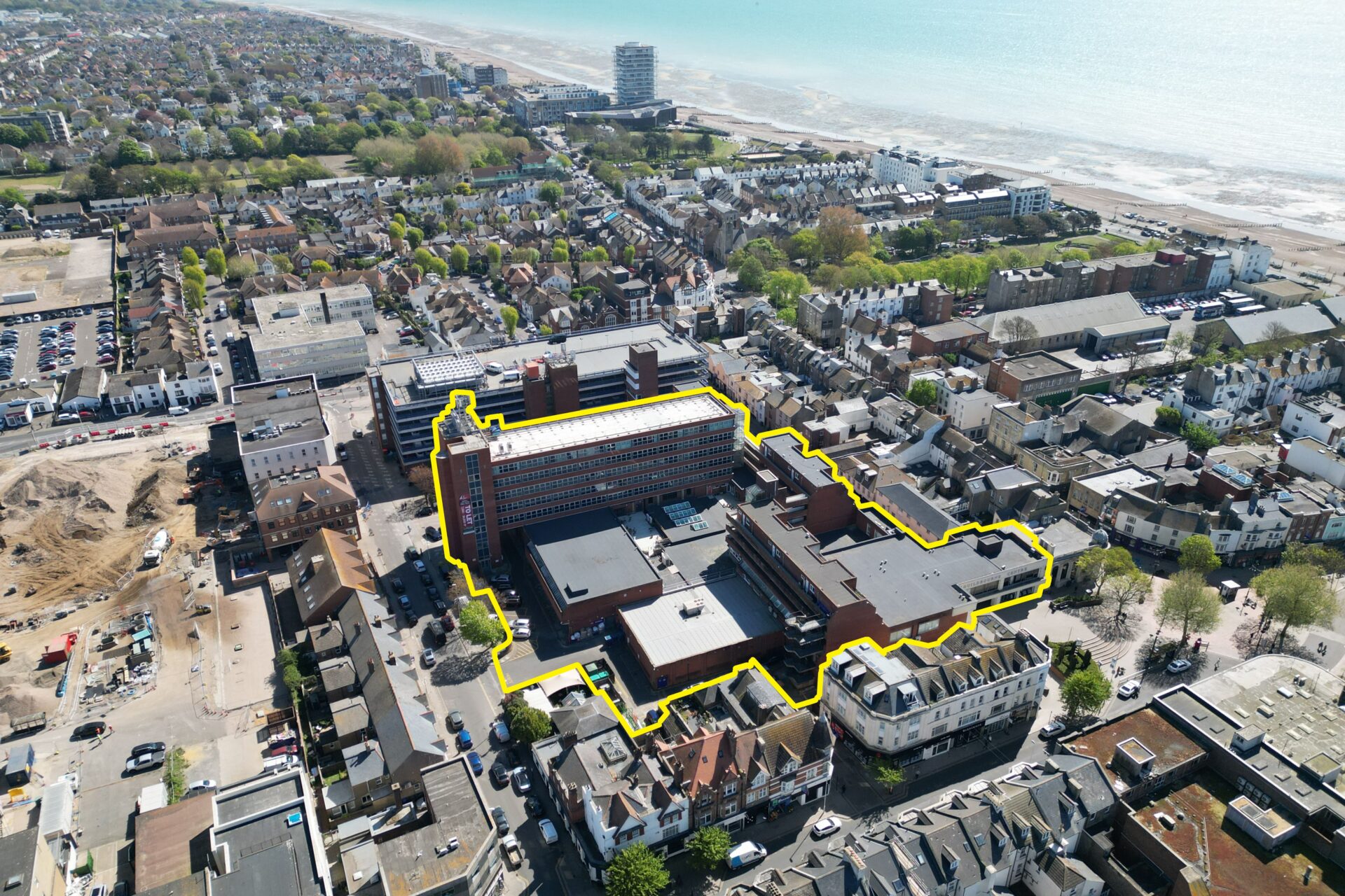 Aerial view of Worthing town centre with a yellow outline surrounding the Guildbourne Centre