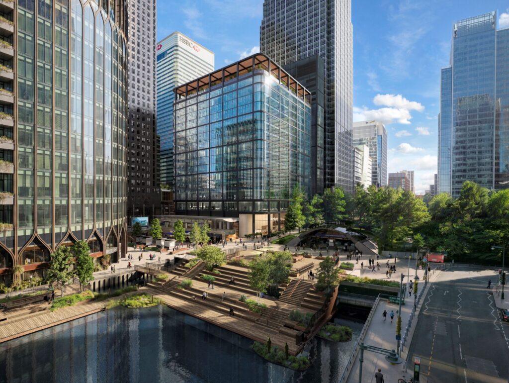 A series of modern glazed office buildings at Canary Wharf with water, landscaping and green public realm in the foreground