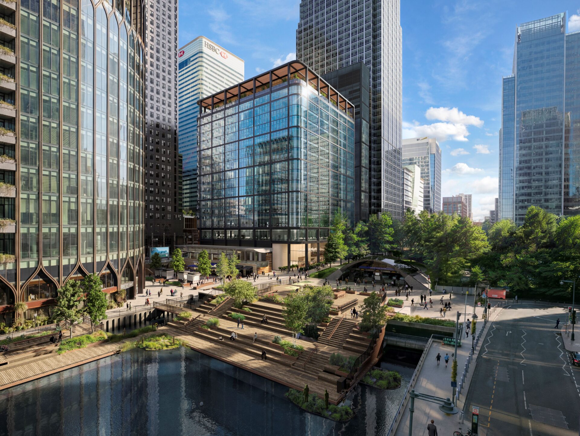 A series of modern glazed office buildings at Canary Wharf with water, landscaping and green public realm in the foreground