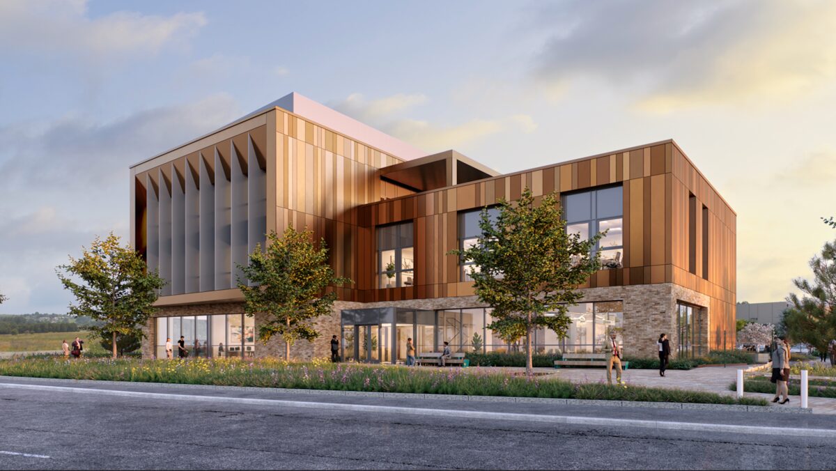 Exterior view of a modern looking building featuring a brick and timber exterior