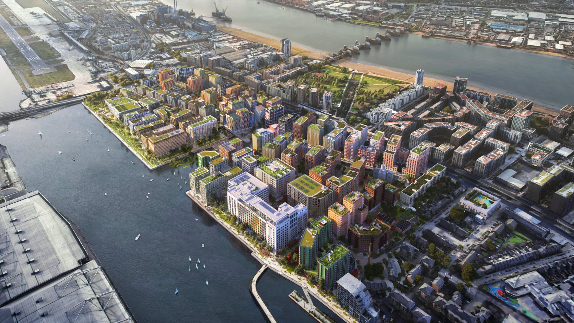 A CGI generated aerial view of a major new development at Silvertown in East London featuring a series of different buildings with a waterway running either side of the development