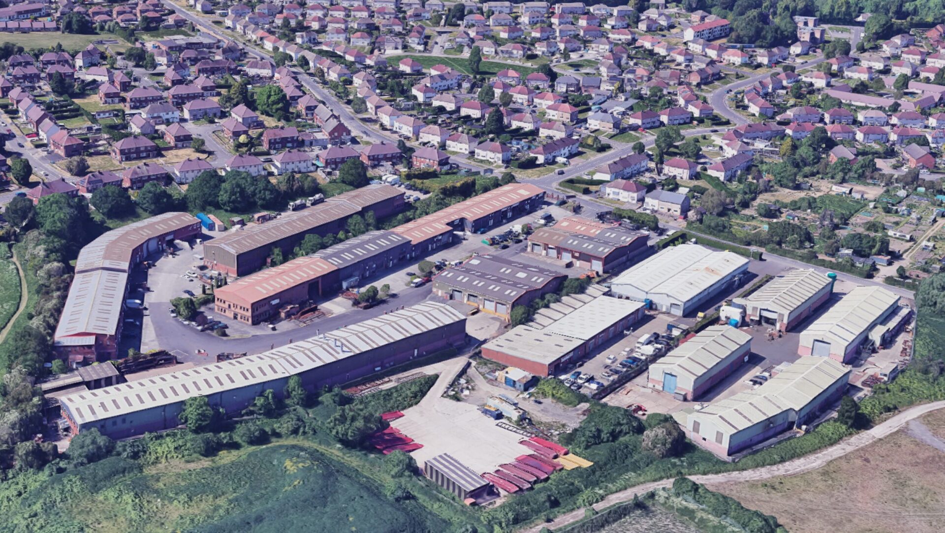 Aerial view of an industrial estate surrounded by housing