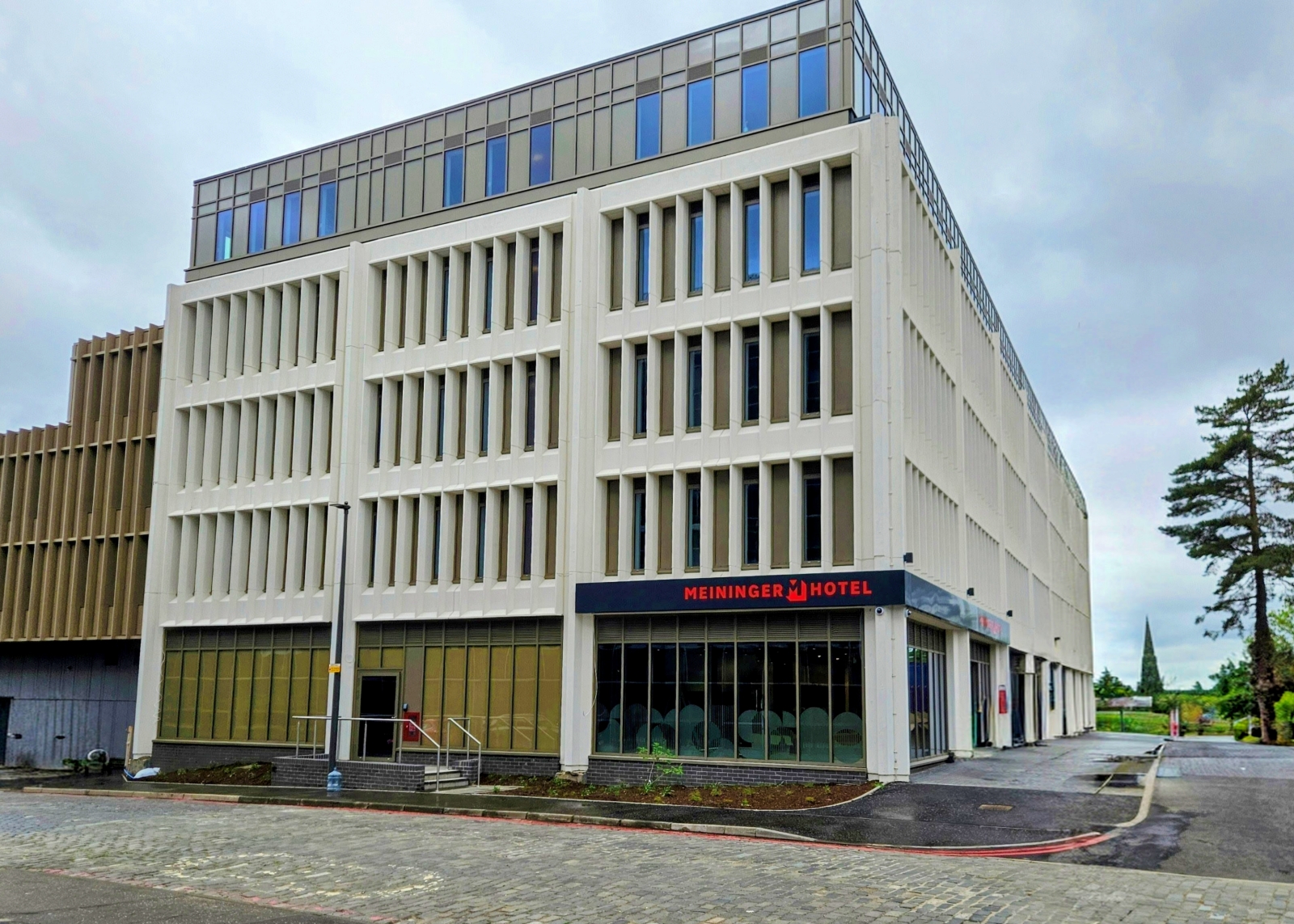 Exterior of a fairly low rise hotel building in Edinburgh featuring lots of windows