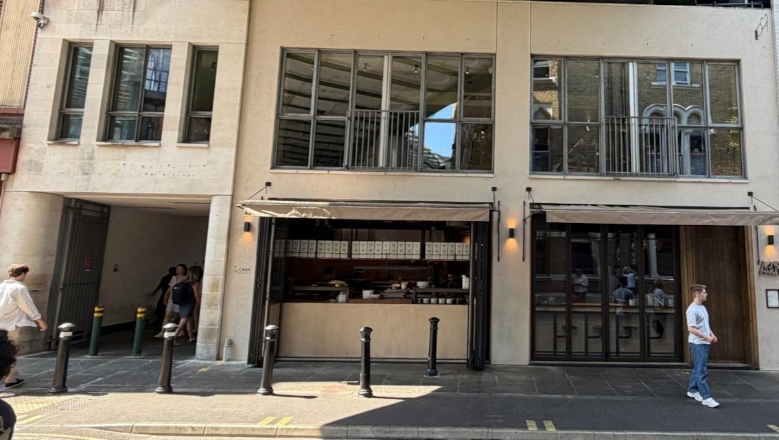 Exterior of a building featuring retail space on the ground floor