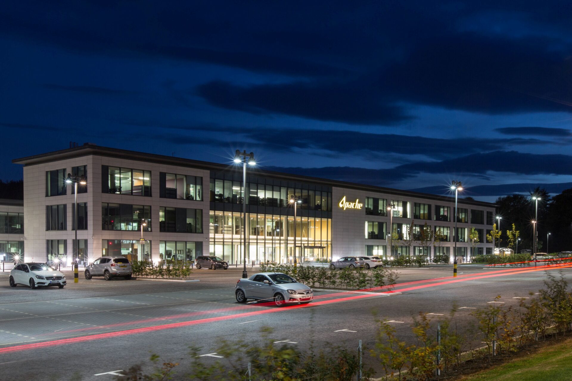 A modern low rise office building at night