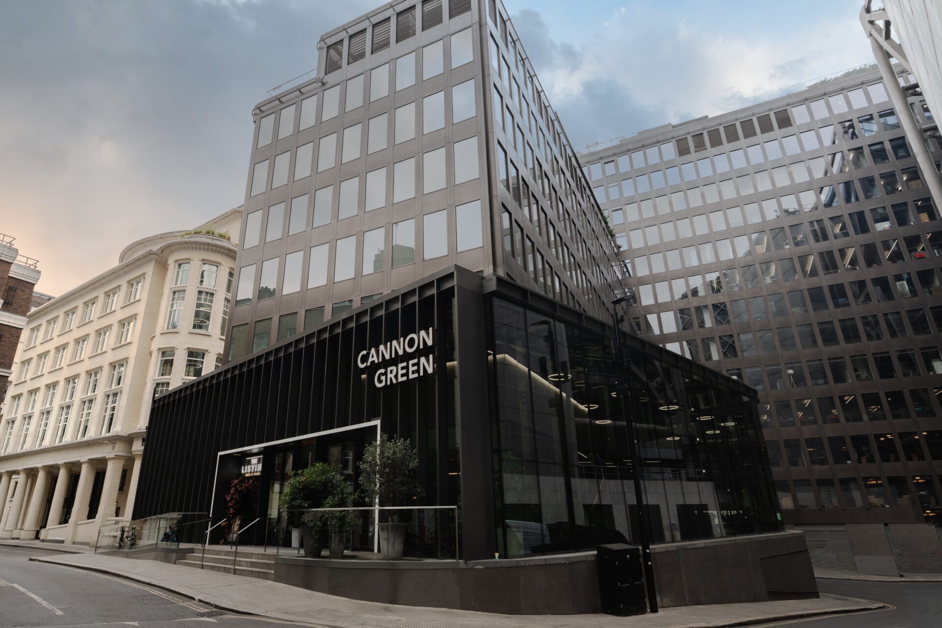 Exterior of an office building with a sign on the ground floor level saying Cannon Green