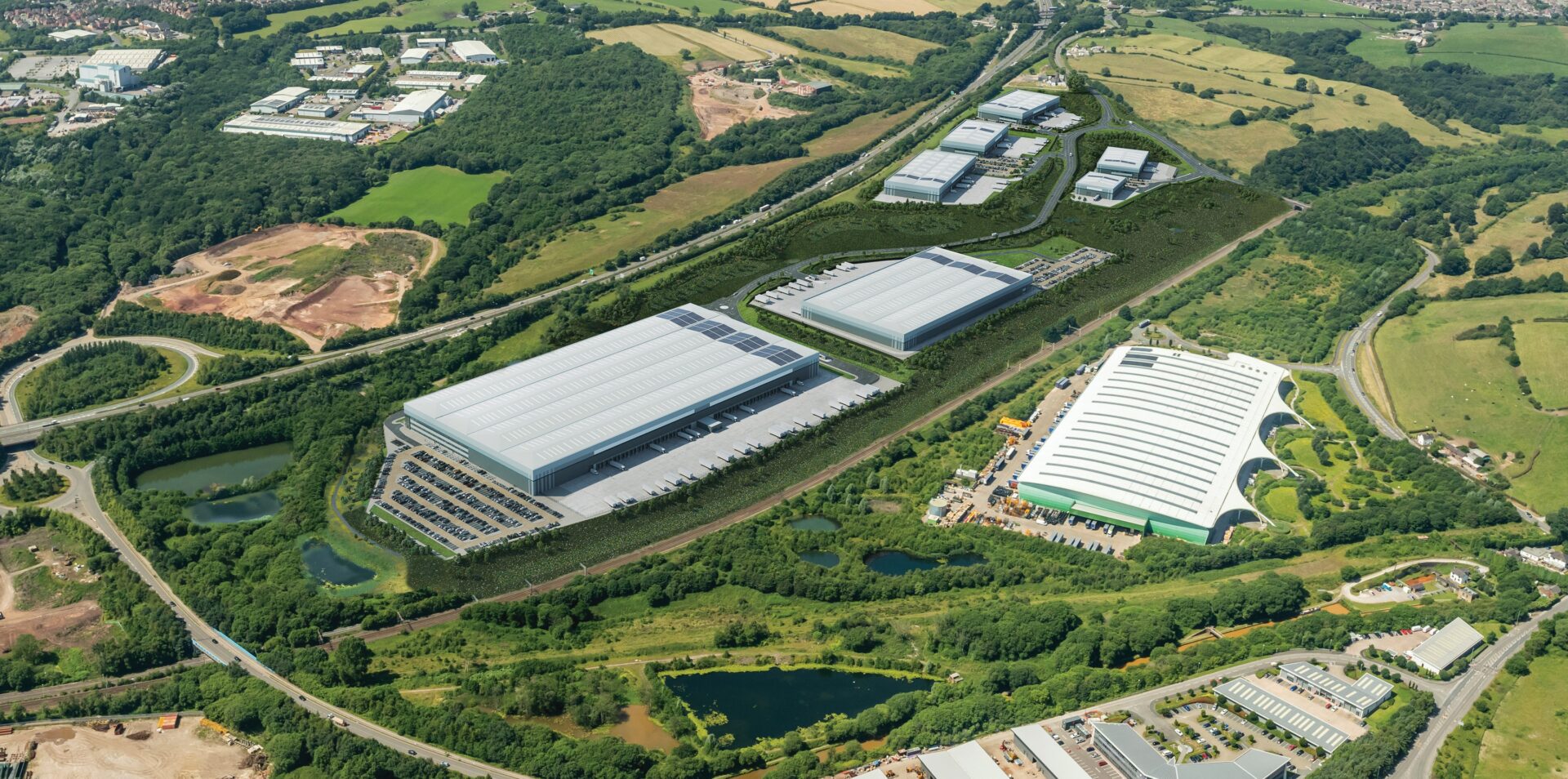 Aerial view of a series of industrial units surrounded by green space
