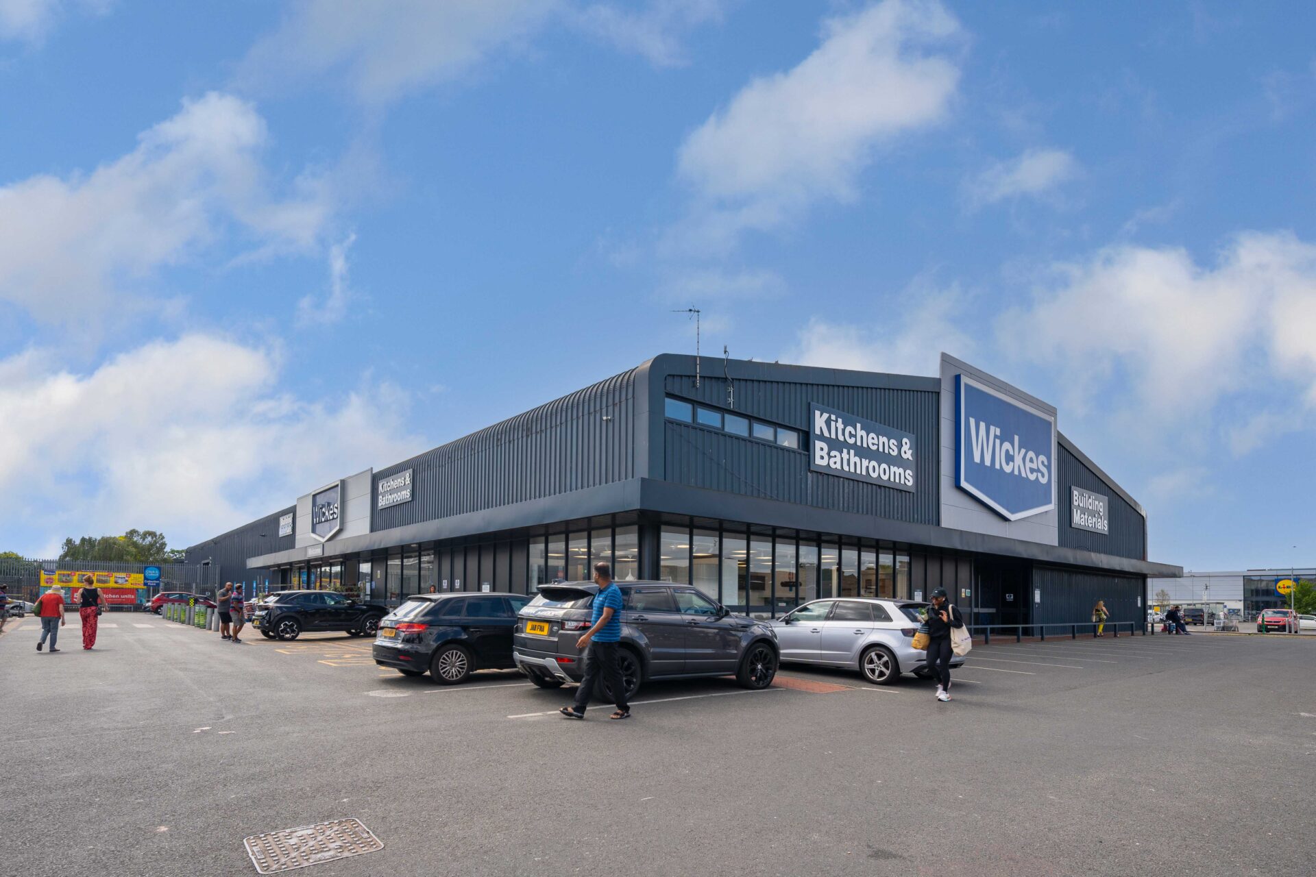 Exterior of a retail warehouse with the Wickes sign on the front