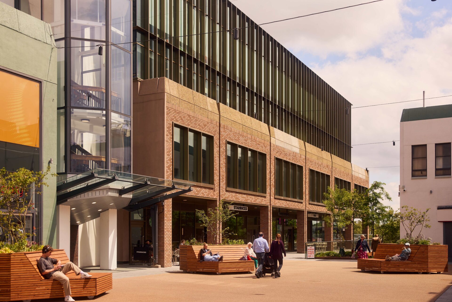 CGI of a glass and brick built building