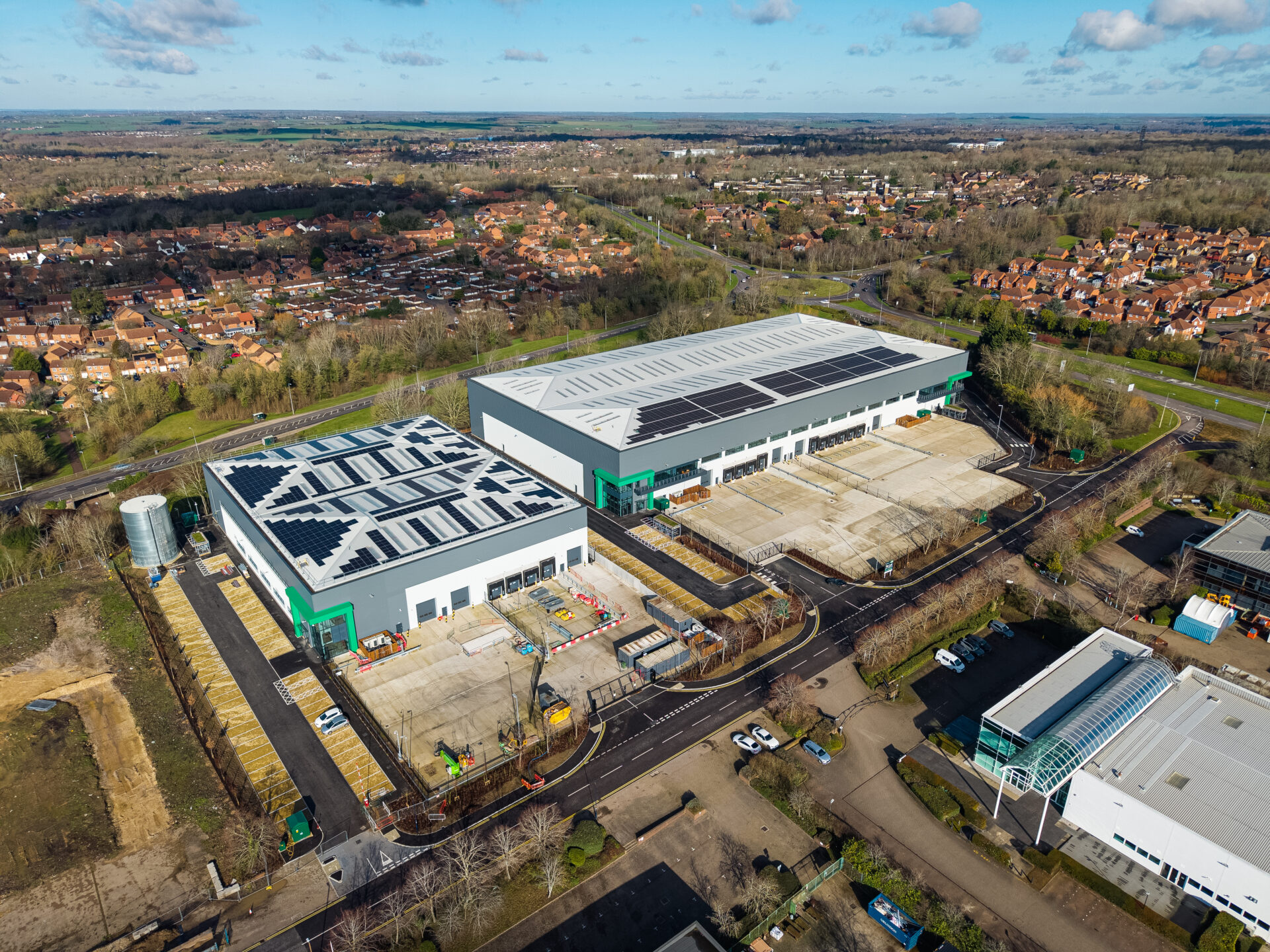 Aerial view of industry building surrounded by houses