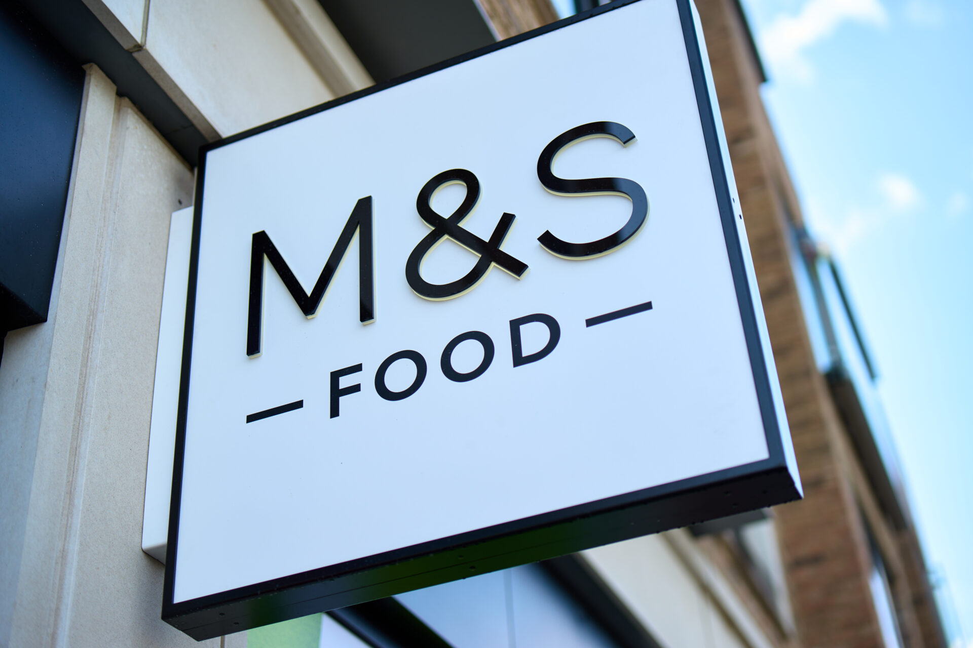 A white sign saying M&S Food