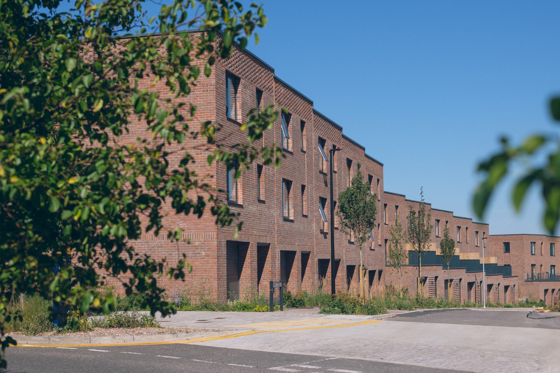 A long row of brick built new homes