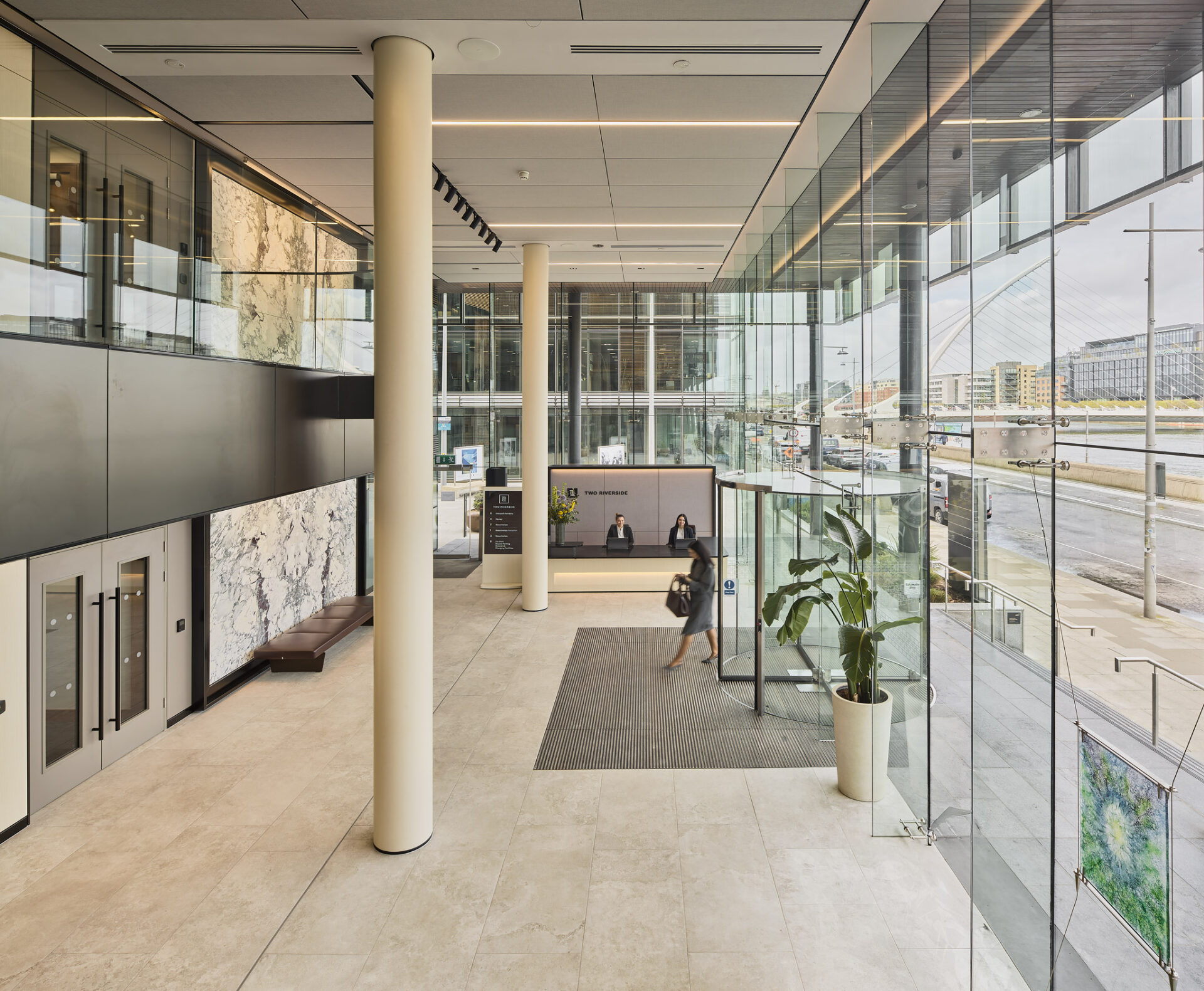 Interior of a modern office foyer with a large glass entrance
