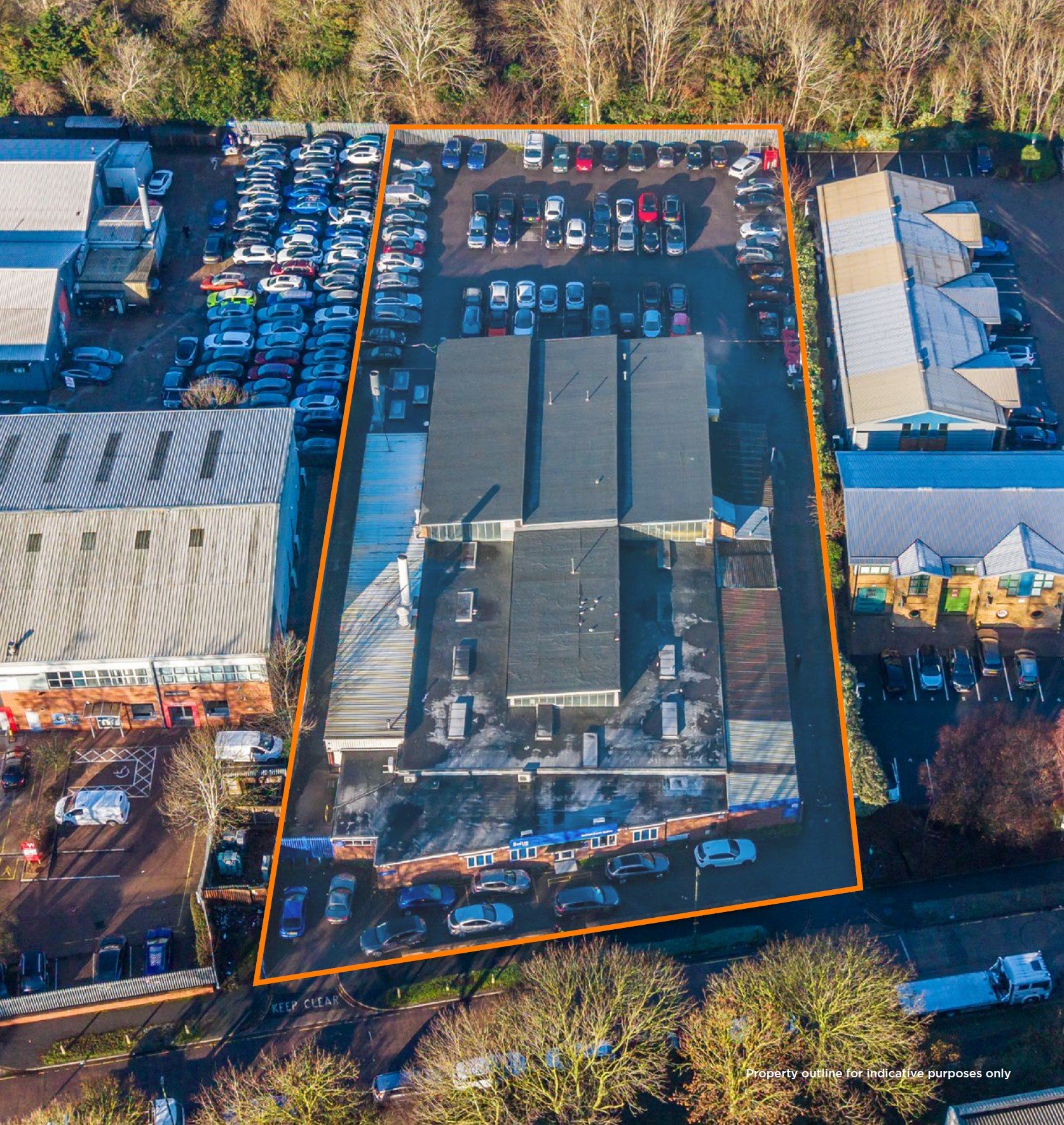 Aerial view of an industrial site surrounded by a read line