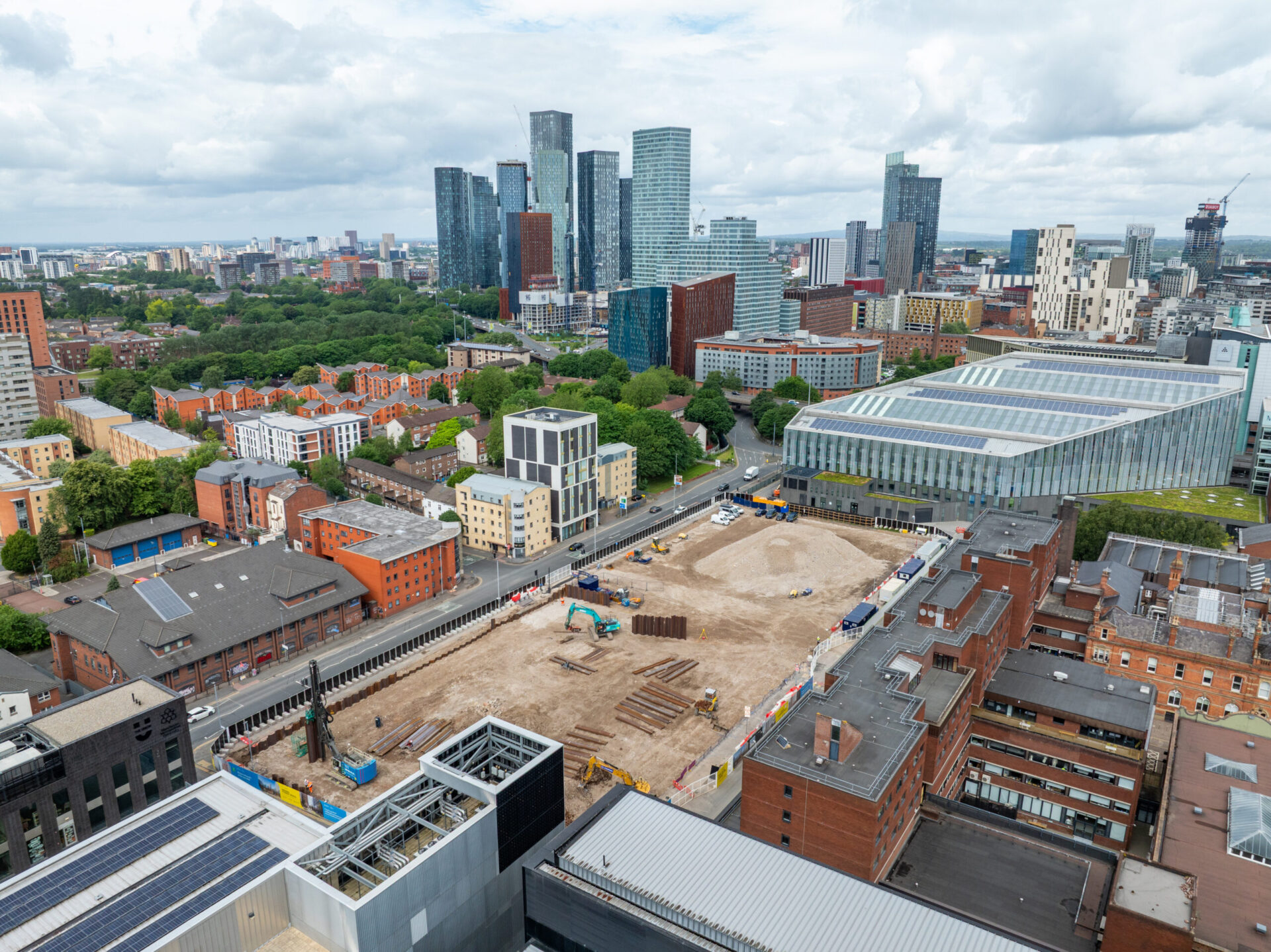 Aerial view of a city centre with a development site in the foreground