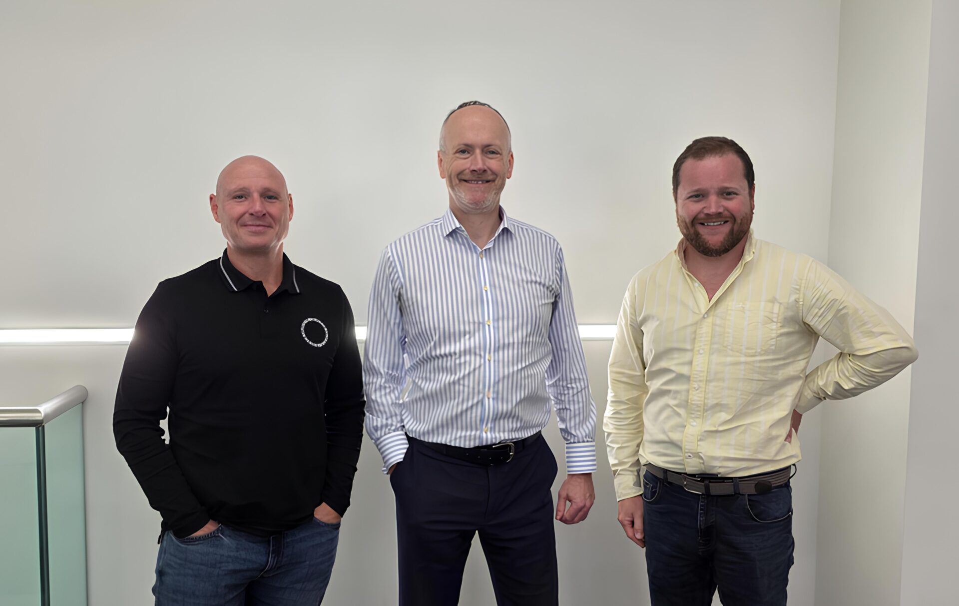 Three smiling men