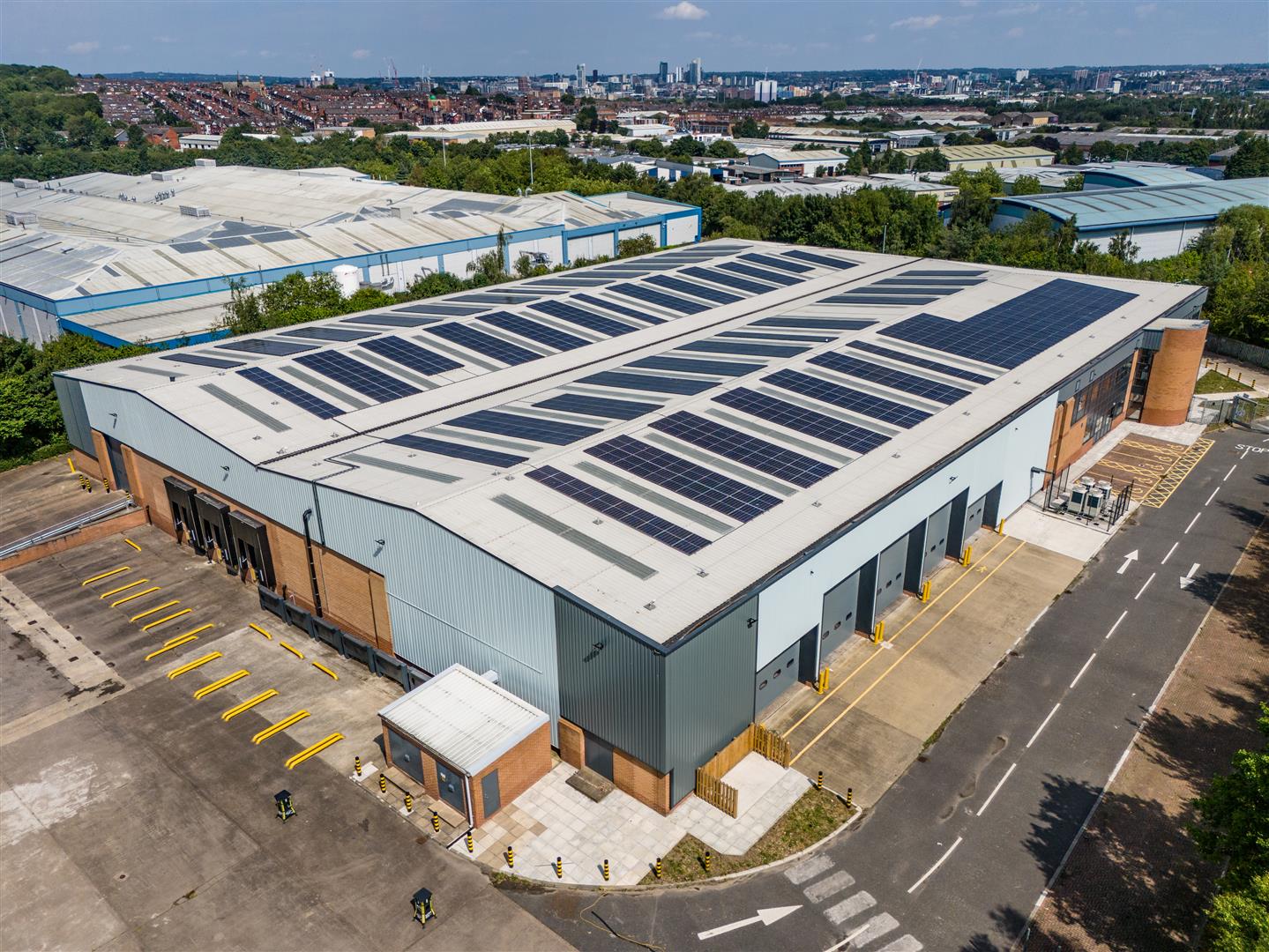 Aerial view of a large warehouse surrounded by other warehouses