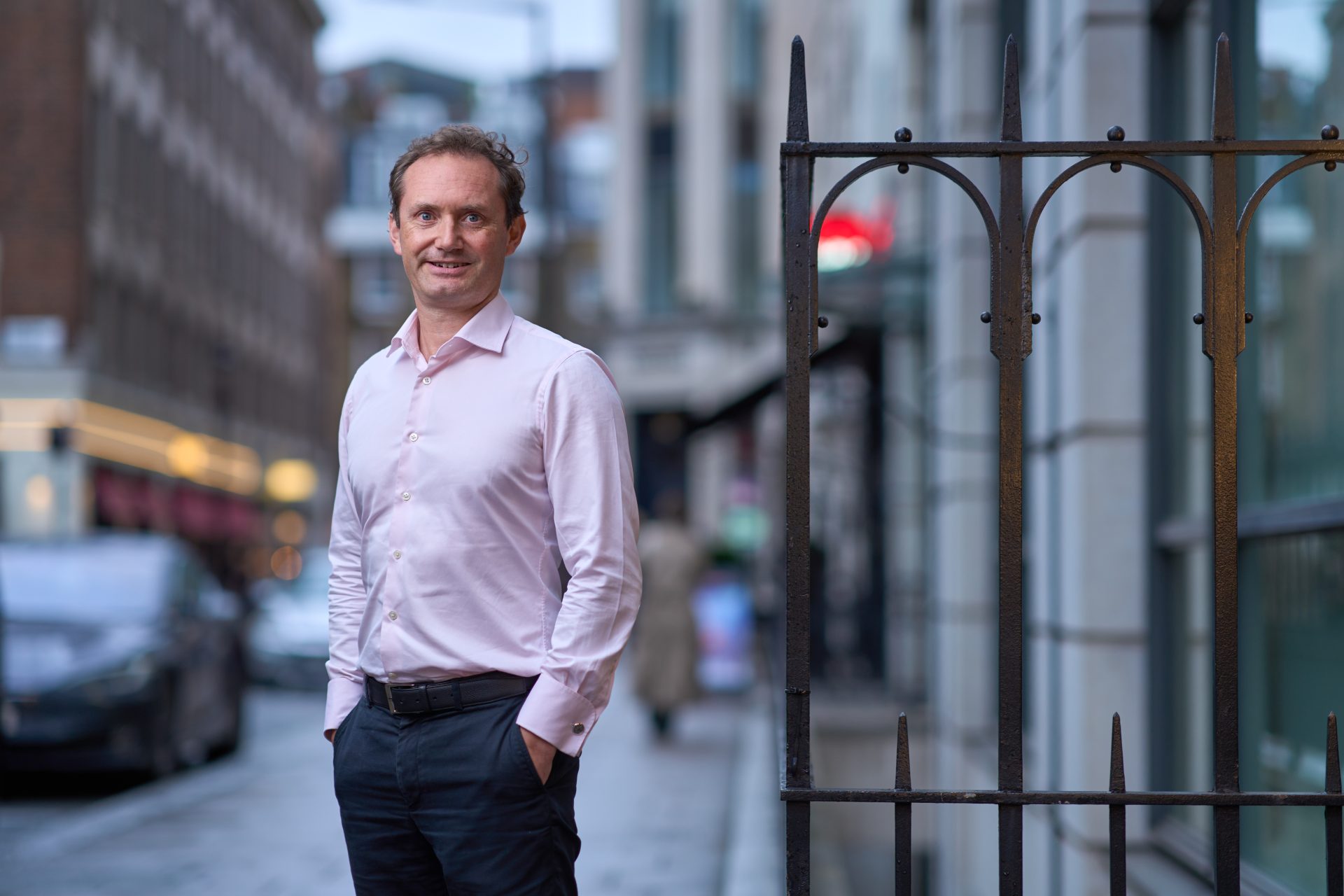 Jason Antill stood on a street with his hands in his pockets