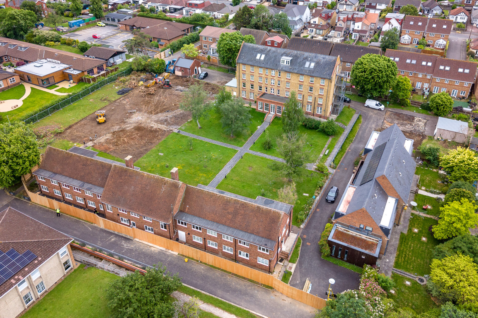 Aerial view of houses with a green square in the middle