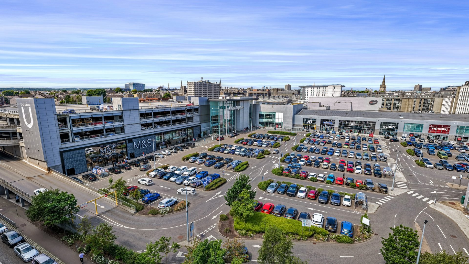 Aerial view of Union Square shopping centre in Aberdeen, with its retail mall, M&S store and busy car parks.