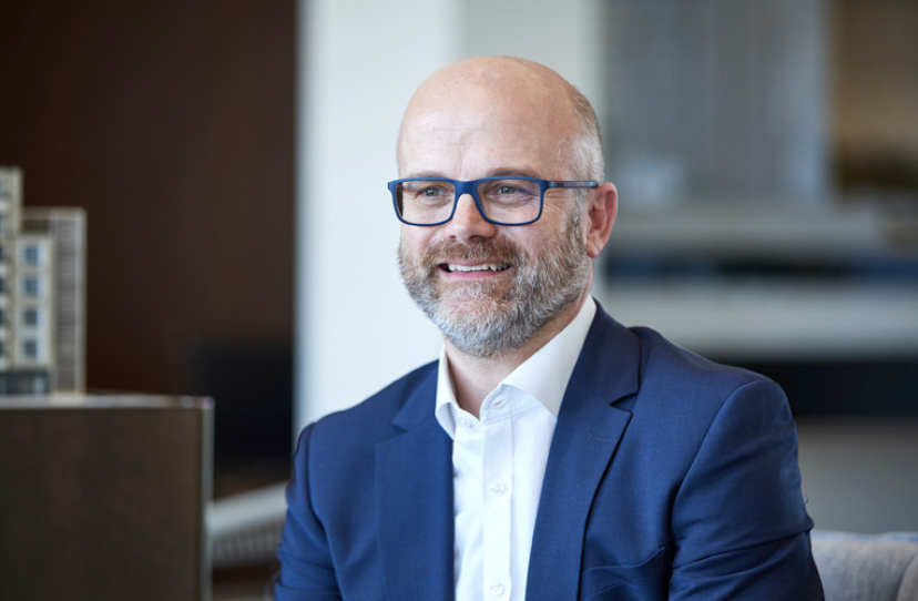 Martin Quinn, newly appointed Stace director of commercial workspace, smiling in a blue suit