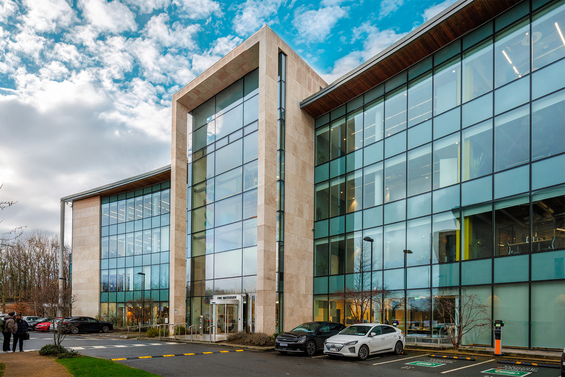 Exterior of One Waterside office building at Dublin’s Waterside Innovation Campus, with cars parked outside