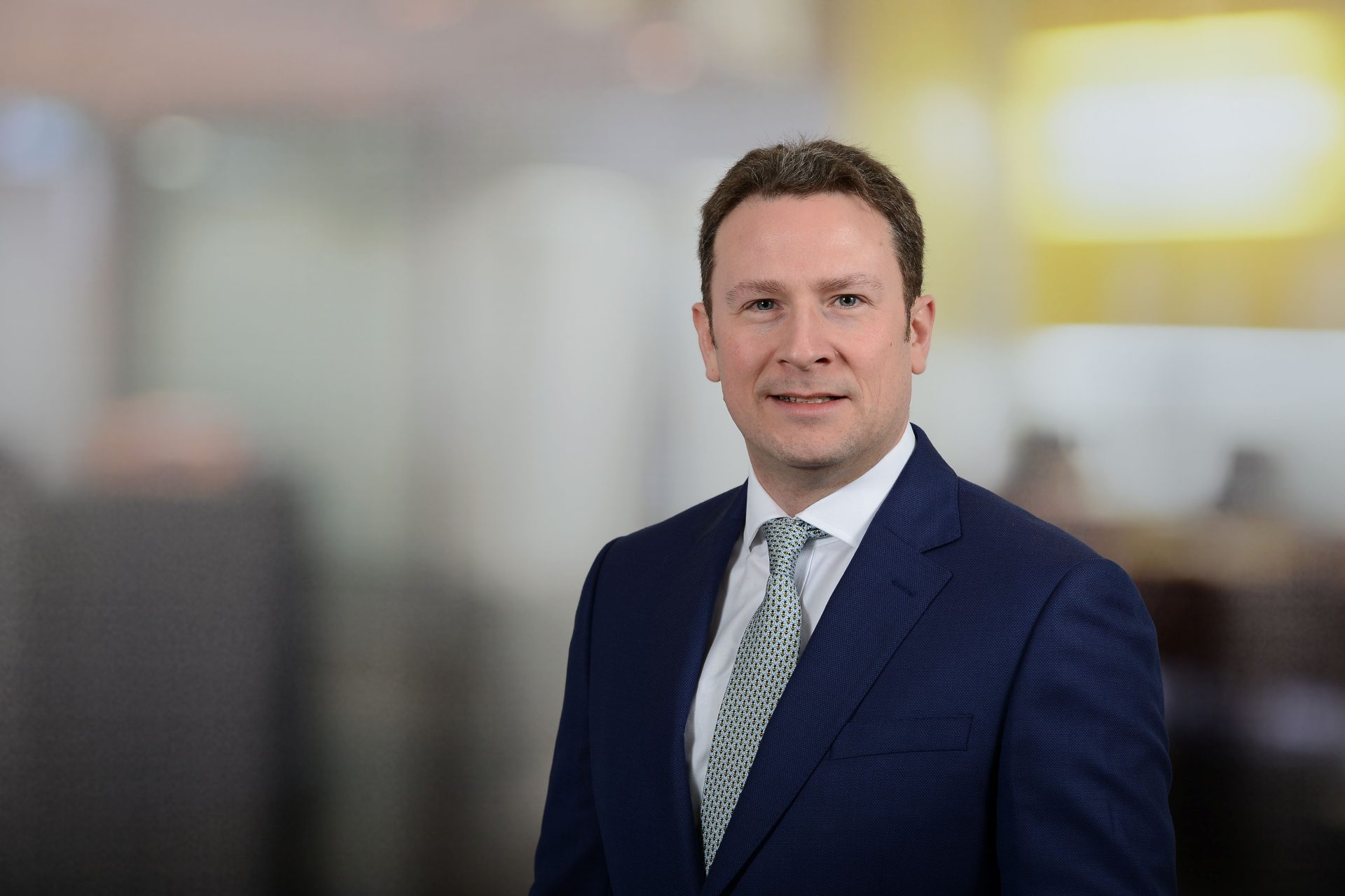 Jamie Adam, Savills’ head of residential development sales for Scotland, wearing a navy suit and tie