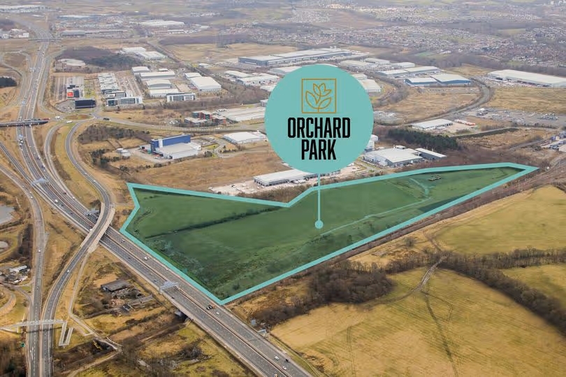 Aerial view of the proposed Orchard Park industrial and logistics site at Eurocentral, outlined in green.