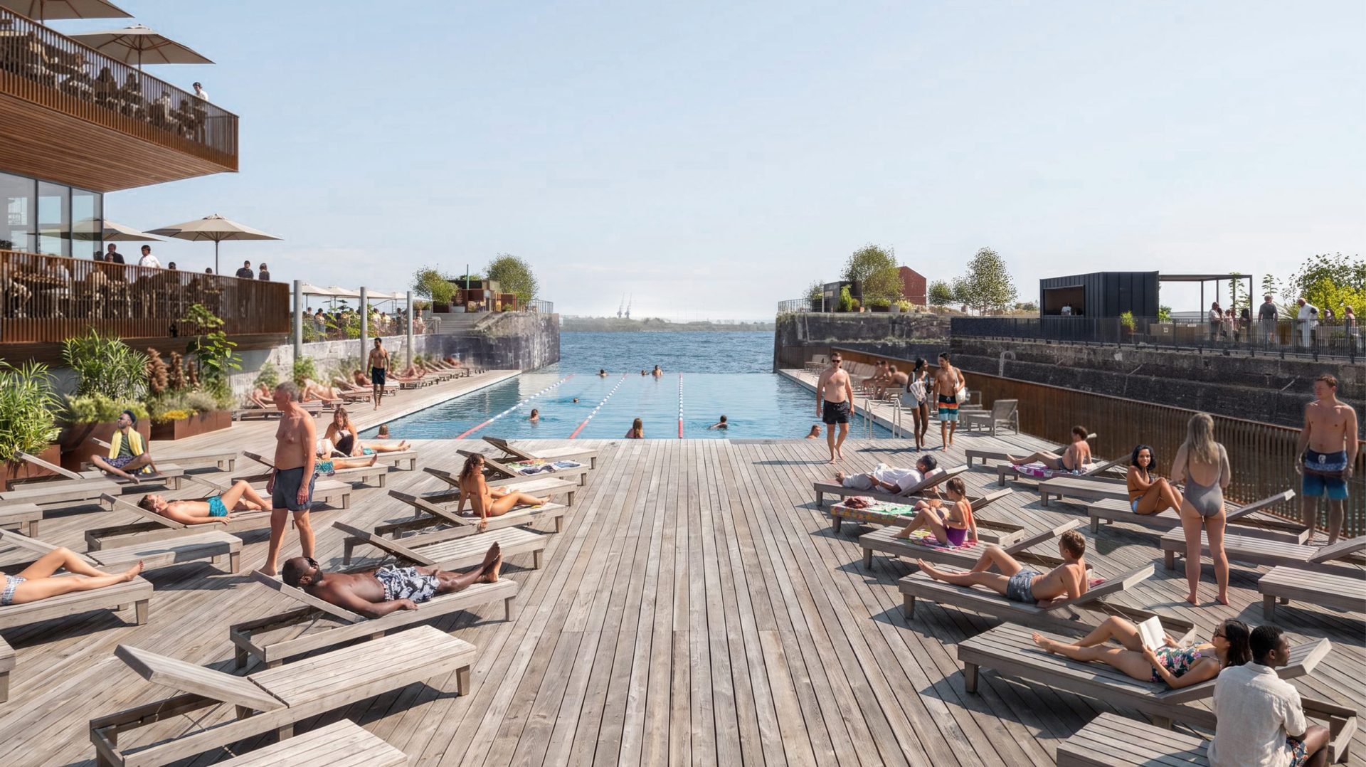 People relaxing beside a large outdoor pool on a waterfront leisure deck