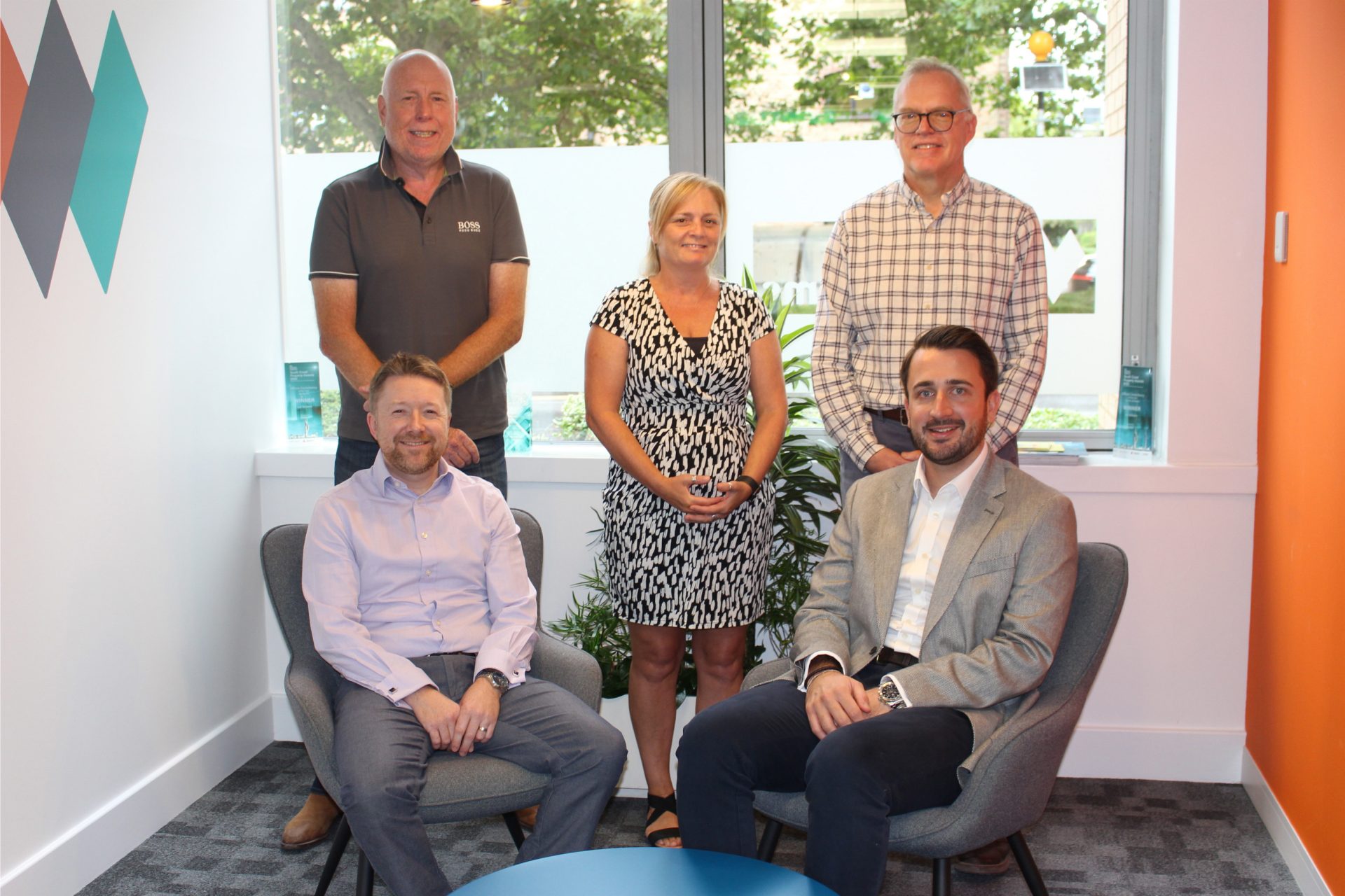Luke Tubbs joins Vail Williams as Associate, pictured with five colleagues on the south coast.