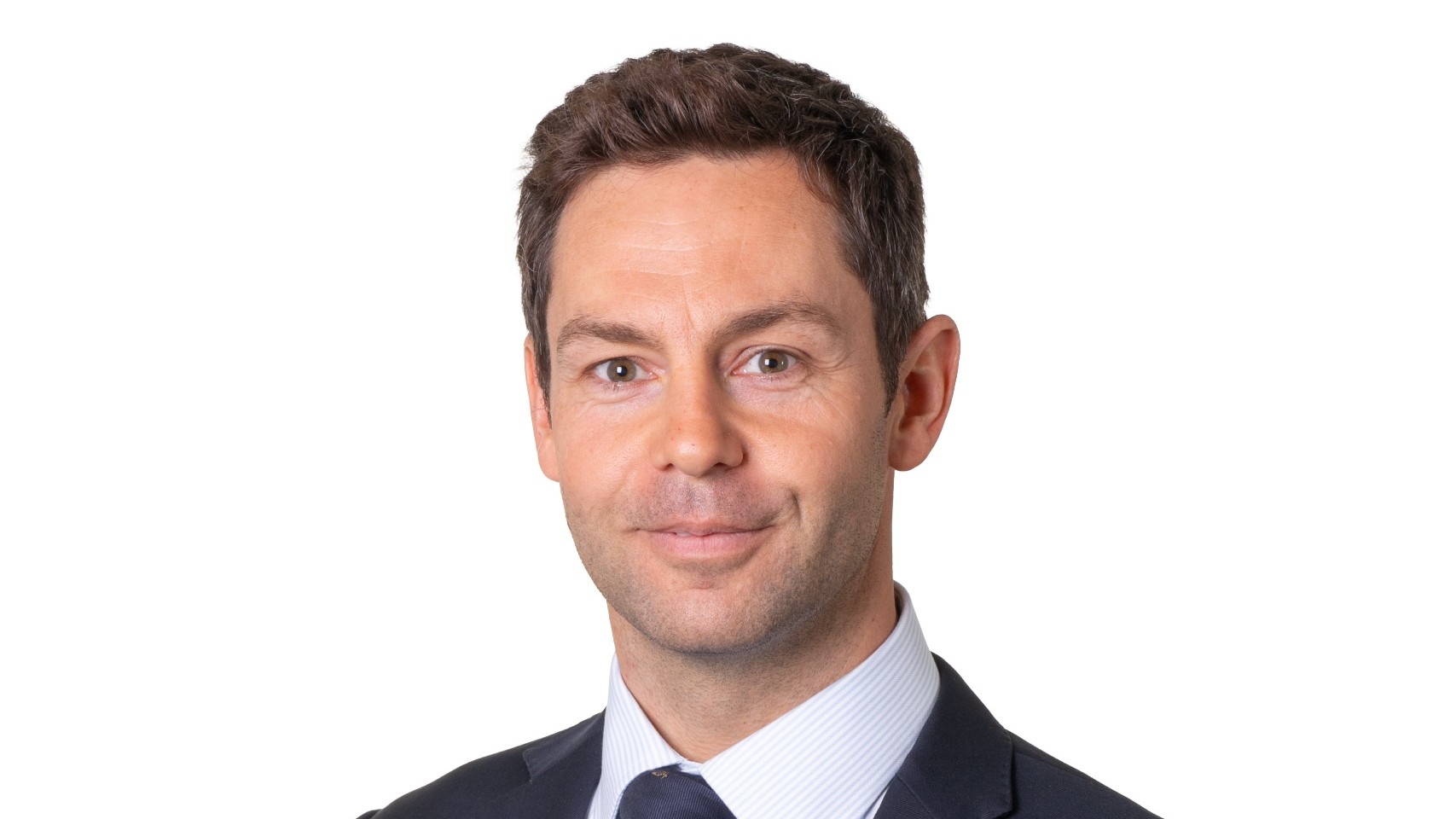 Simon Woodcock, newly appointed Norton Rose Fulbright real estate partner, in a navy suit and tie