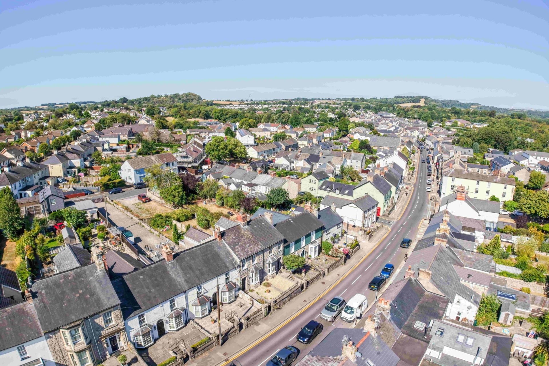 Aerial view of a residential neighborhood in Cowbridge, with rows of houses and streets.