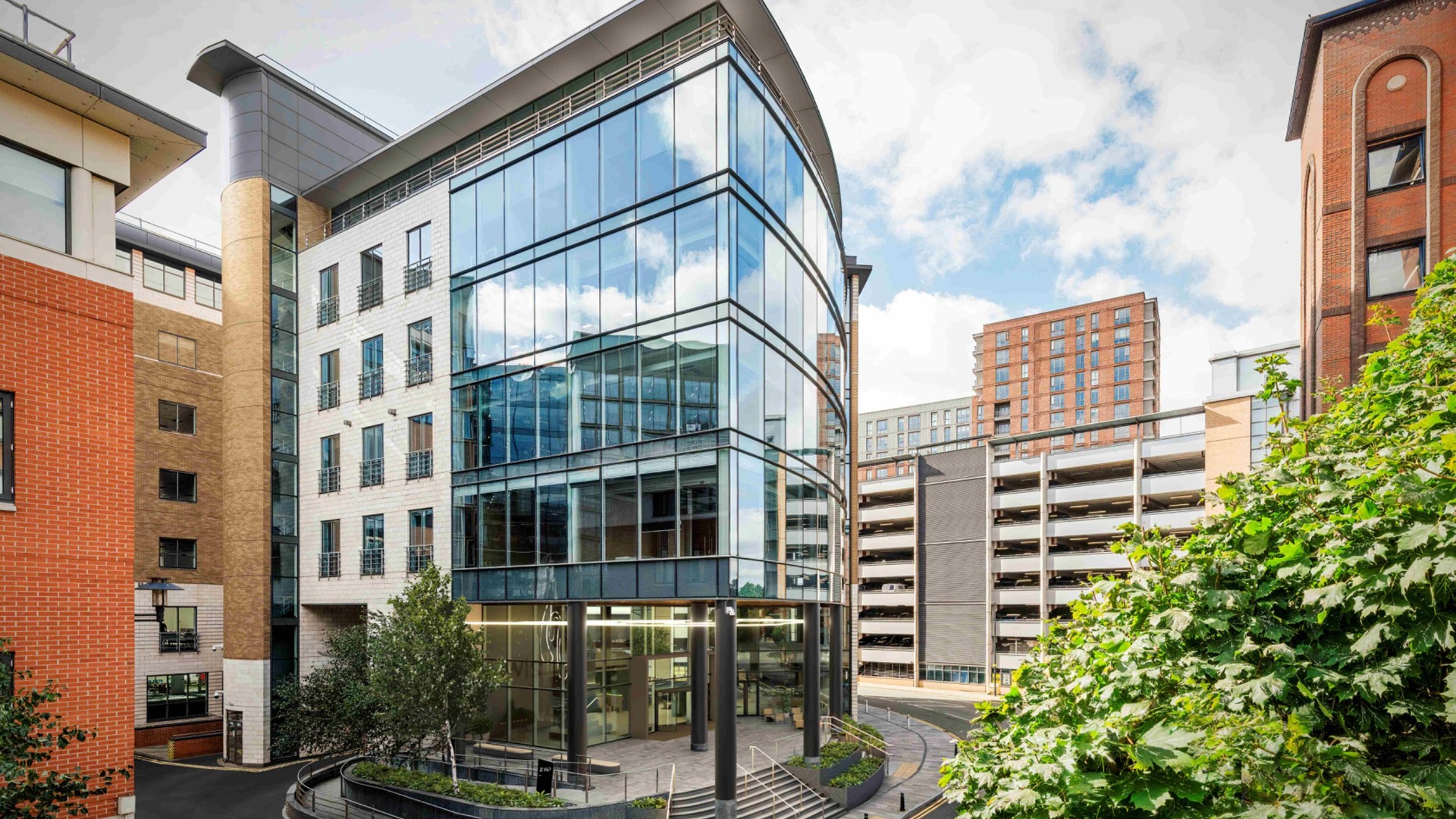 Architectural rendering of 2 Wellington Place, a modern glass-fronted office building in Leeds.