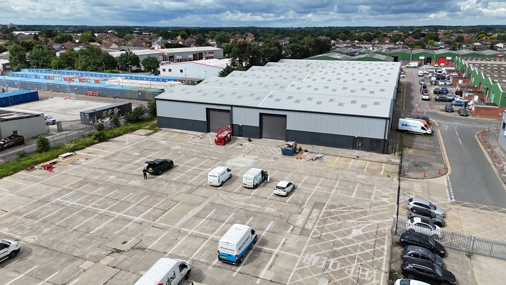 Aerial view of Union Park Industrial Estate, showing the refurbished warehouse and delivery vehicles in the parking area.