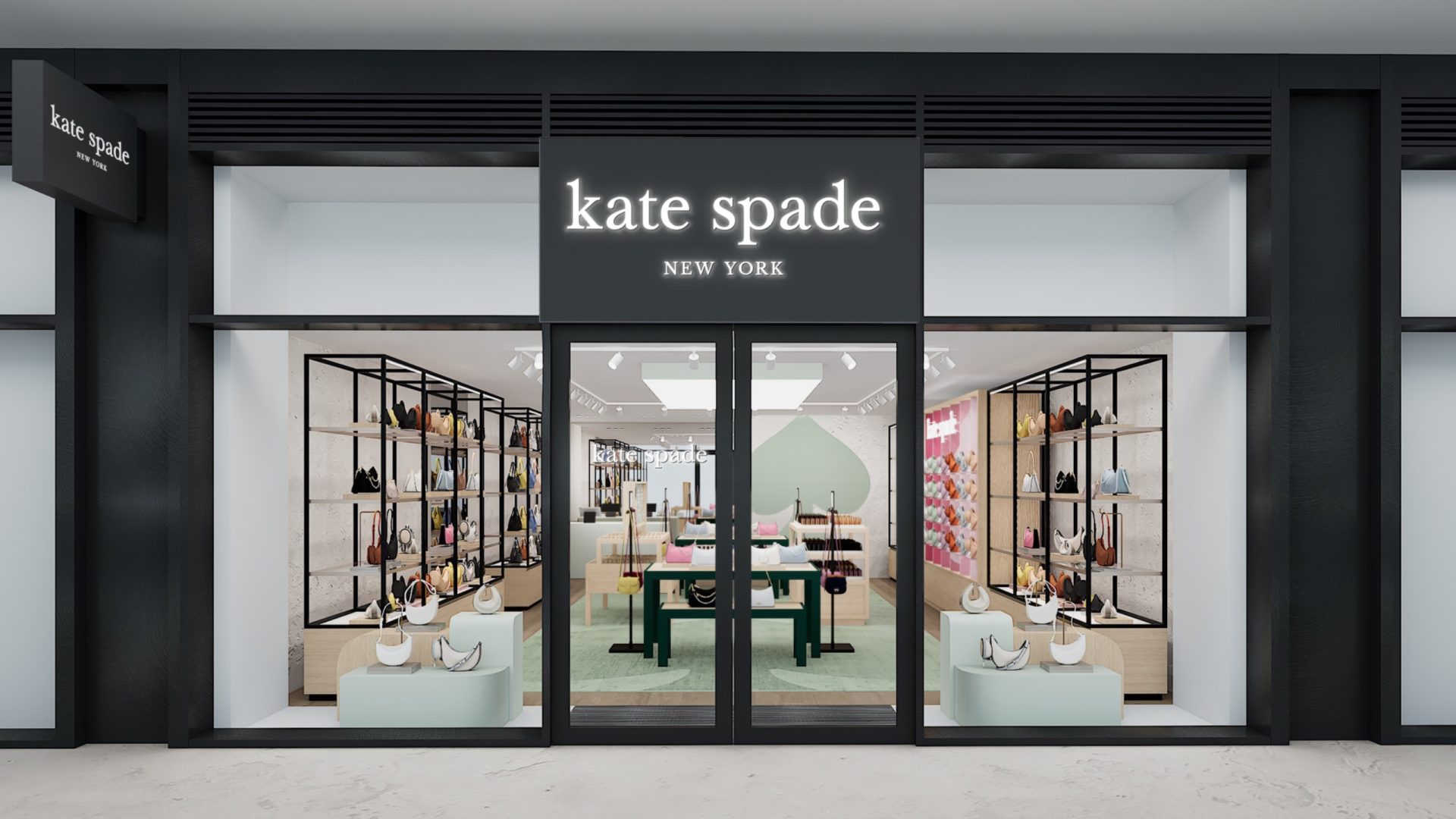 Kate Spade New York storefront at London Designer Outlet, with clothing and accessories displayed in the windows.