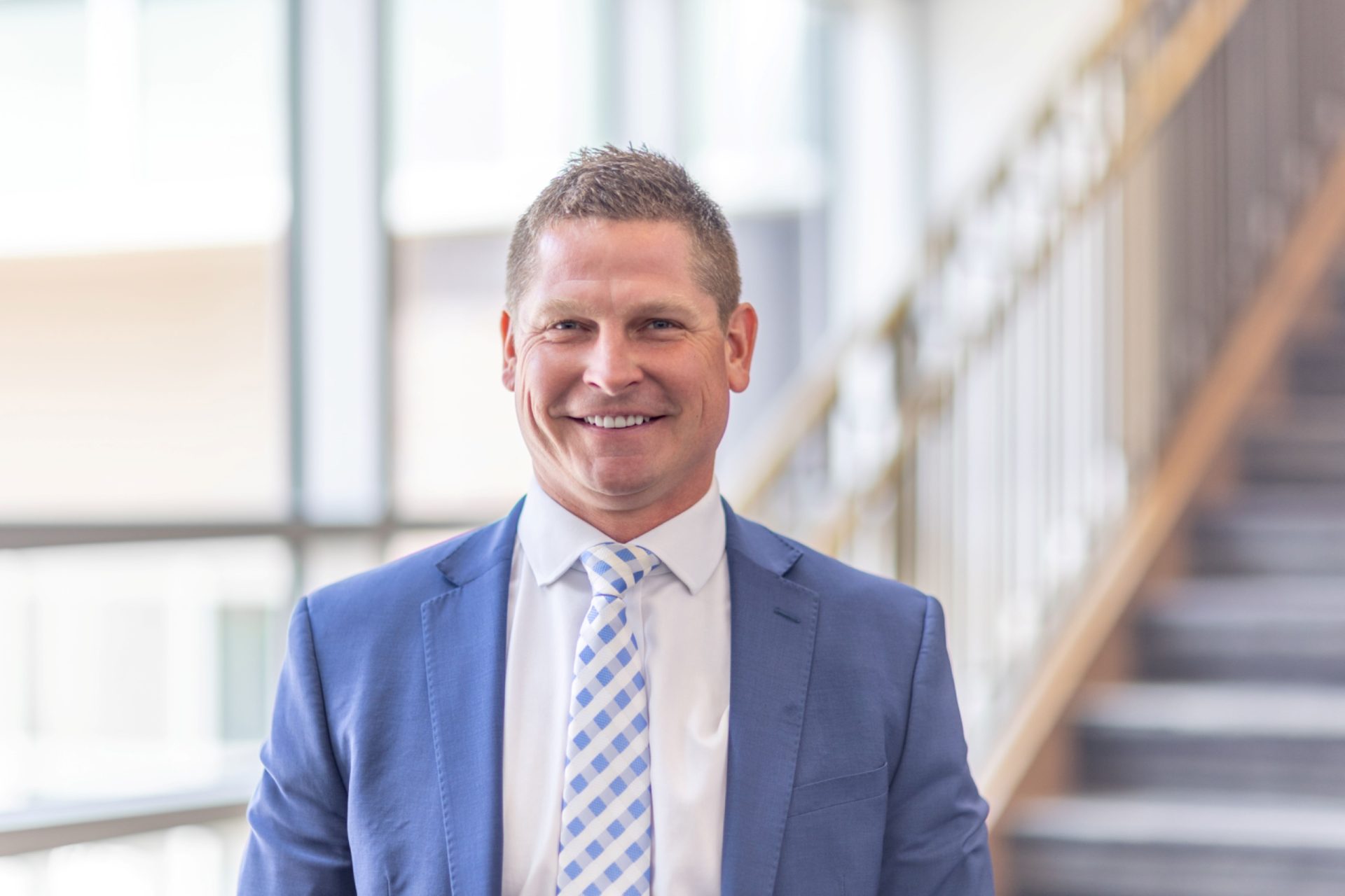 Andy Yosten, HDR’s new building engineering services president, in a suit and tie