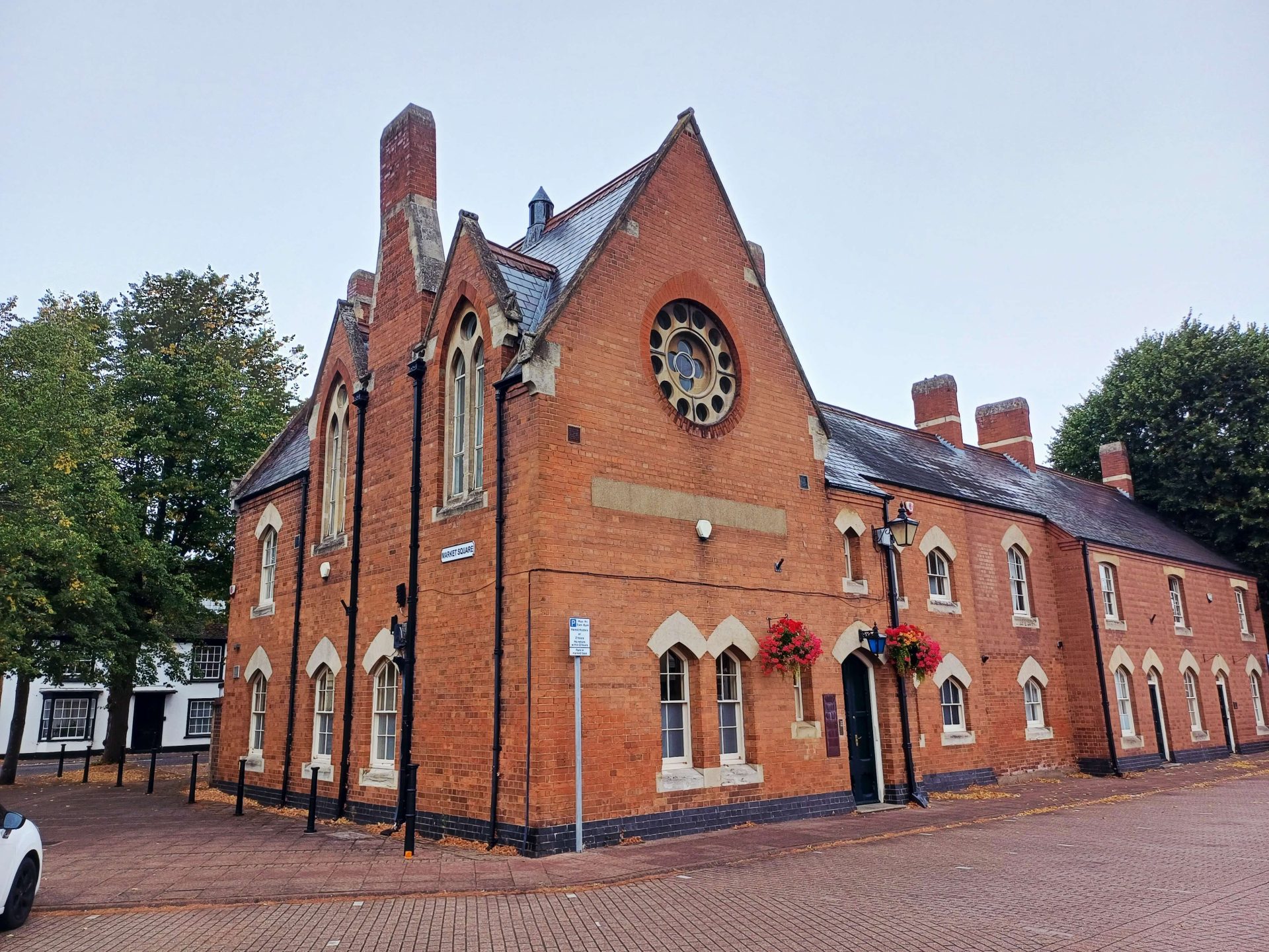 The red-brick Old Court House, a former courthouse and police station, on Market Square in Stony Stratford.