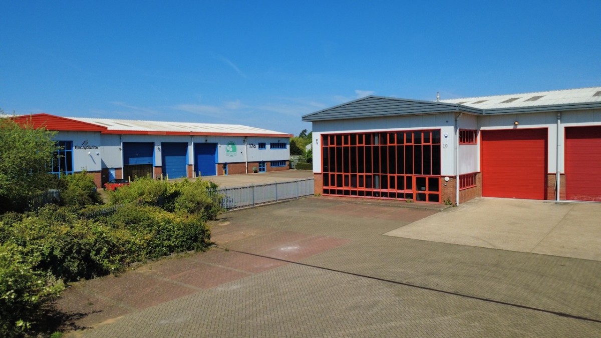 Three warehouse units at Chartmoor Road in Leighton Buzzard, with loading bays and a paved yard.